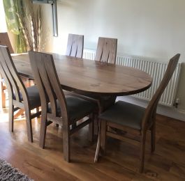 A Brand New Design of Dining Table and Chairs handcrafted from solid Pine with an elegant Oak stain and lacquered finish. : Click Here To View Larger Image